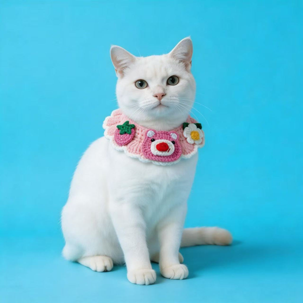 White Cat Wearing Handmade Crochet Pink Bear Strawberry Flower Collar in Side View, Cute Knitted Pet Neckwear, Handmade Pet Accessories for Photoshoots